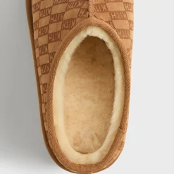 Chaussons en peau lainée monogrammée Kith