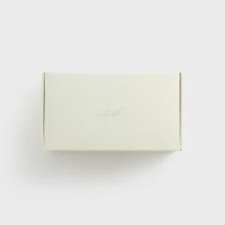Chaussons en peau lainée monogrammée Kith
