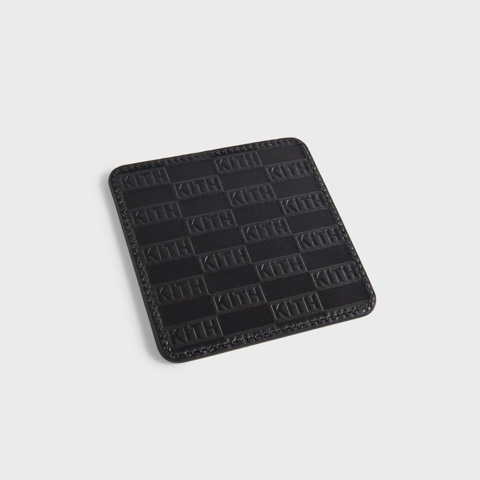 Dessous de verre en cuir monogramme Kith