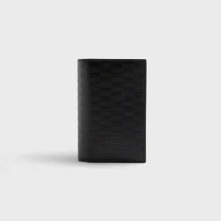 Porte-passeport en cuir monogrammé Kith