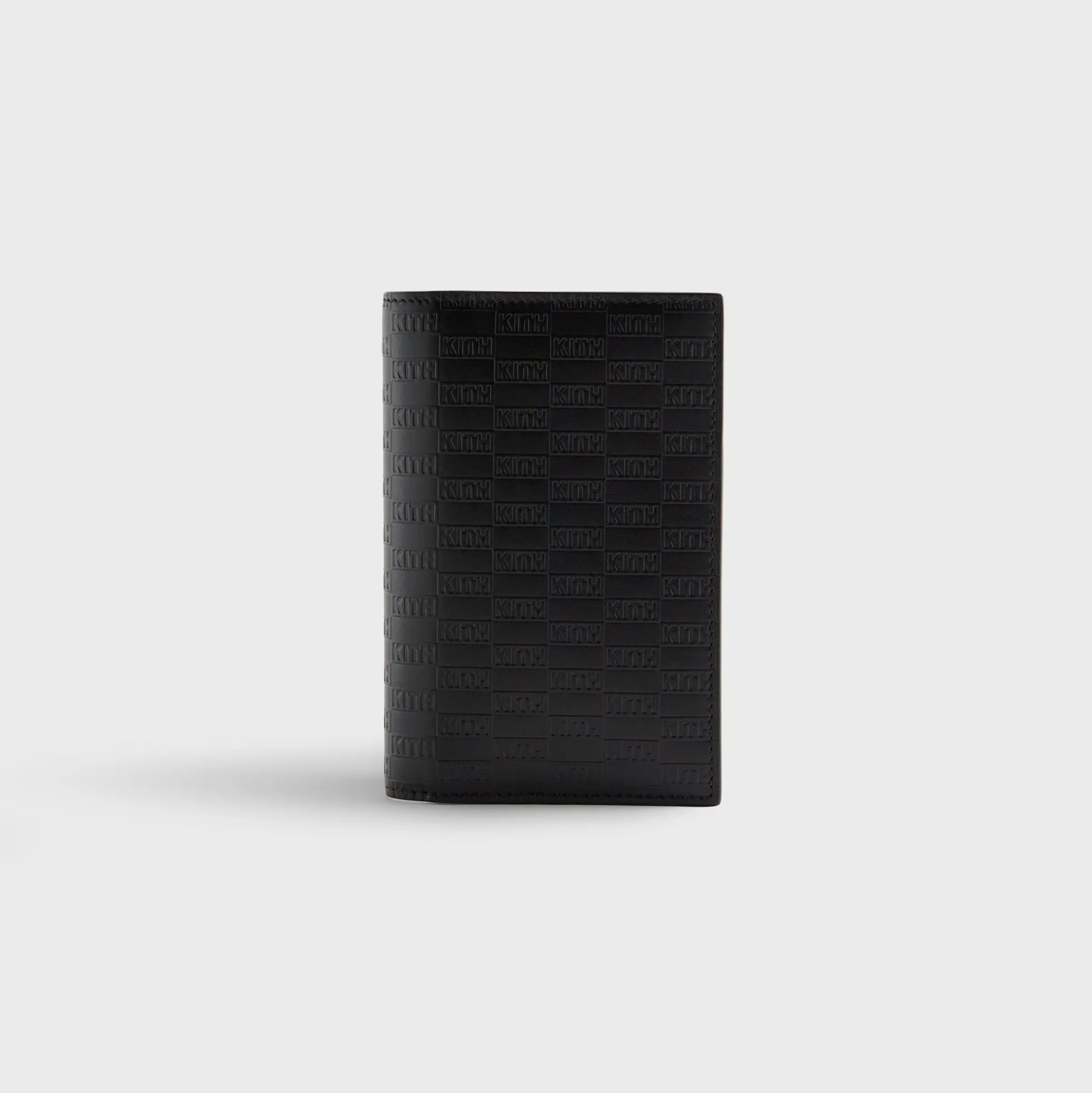 Porte-passeport en cuir monogrammé Kith