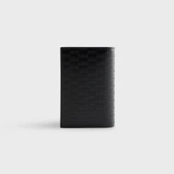Porte-passeport en cuir monogrammé Kith