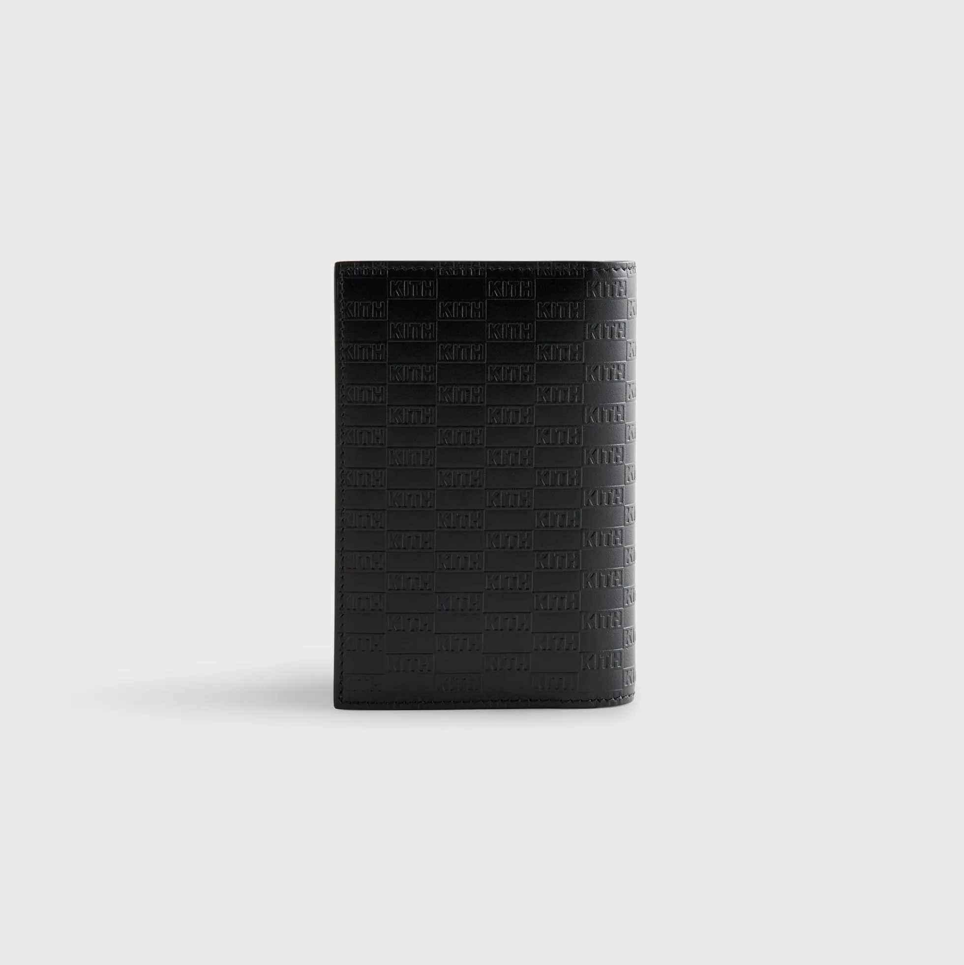 Porte-passeport en cuir monogrammé Kith