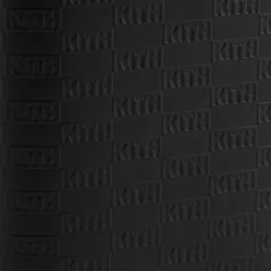 Porte-passeport en cuir monogrammé Kith